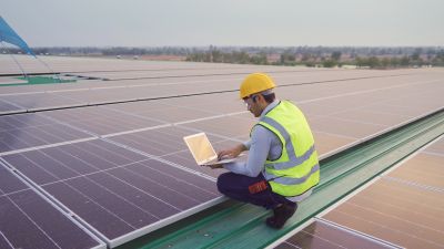 Technician Installing Residential Solar Panels